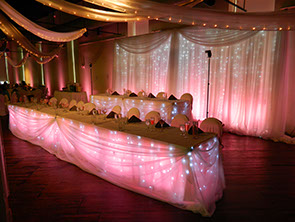 Wedding Backdrop with LED Curtains and Pink Uplighting